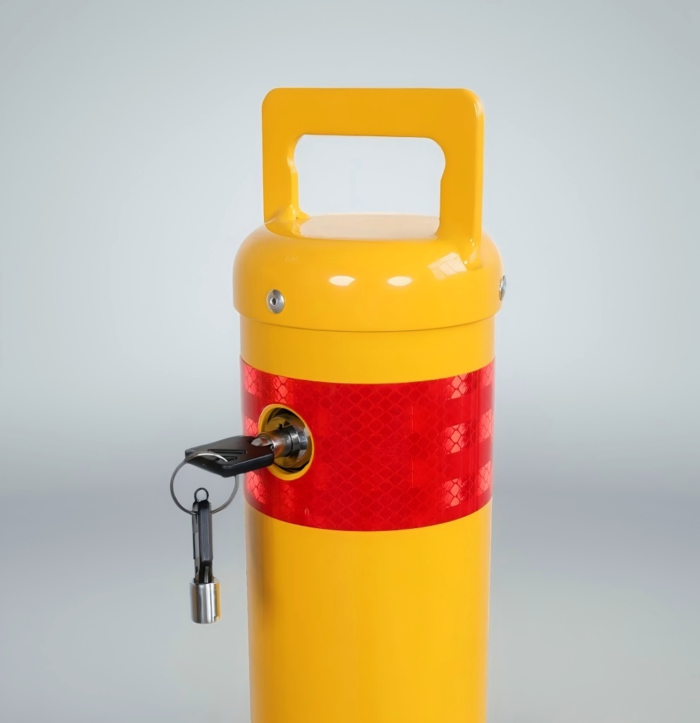 Close-up of heavy-duty keylock system providing tamper-resistant security for removable bollards in commercial or public spaces.
