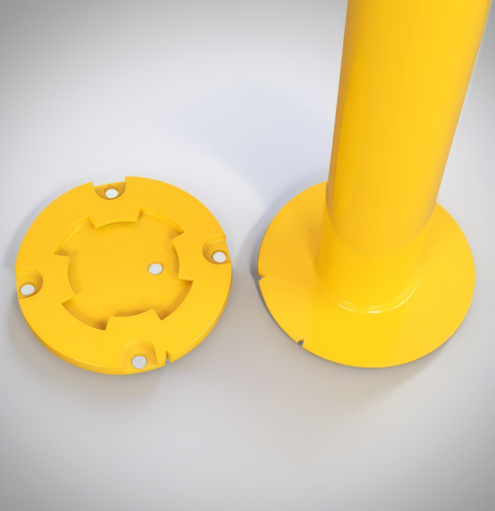 Close-up of detachable flange base for secure anchoring of surface-mounted bollards.
