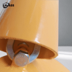 Top view close-up of yellow rebound bollard base connection components.