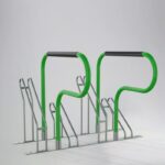 Green E-coated and powder coated Triangle stand bike rack with black handles, designed for outdoor or public space use.