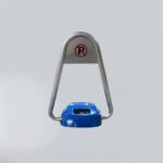 Frontal view of solar parking lock with blue body and silver swing arms, clean background highlights structural components and no-parking sign.