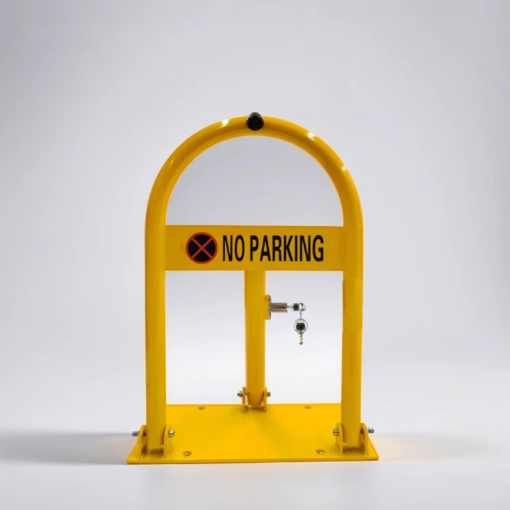 Yellow manual parking lock with built-in lock and 'NO PARKING' label, installed to reserve exclusive parking spaces.
