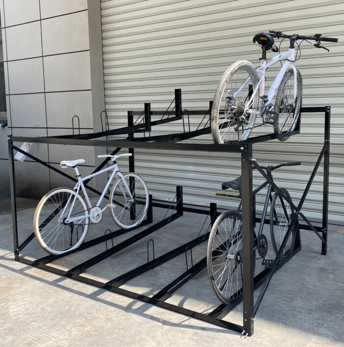 Fixed two-tier 10-slot bike rack without gas assist, installed outdoors for public or institutional use.