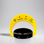 Close-up of yellow IoT parking lock showing support for IoT, Bluetooth, LoRa, and PC systems, indicating multi-mode connectivity.