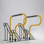 Yellow E-coated and powder coated Triangle stand bike rack with black components, highly visible and corrosion-resistant for various environments.