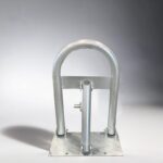 Side view of galvanized carbon steel parking bollard, highlighting the metal frame and key-operated locking mechanism.