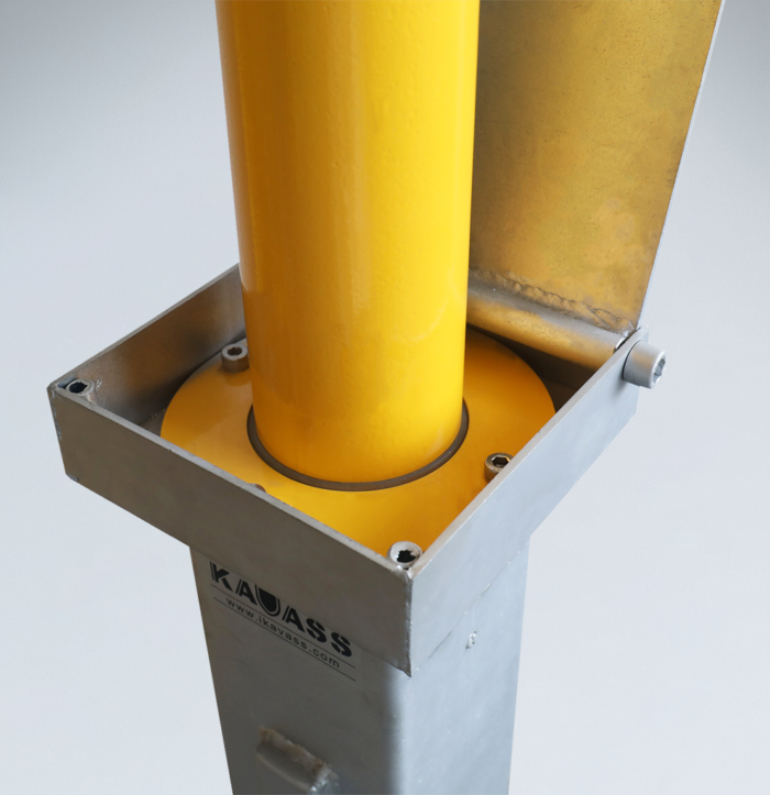 Close-up of the base structure of manual carbon steel retractable bollard, used for parking security and access control.