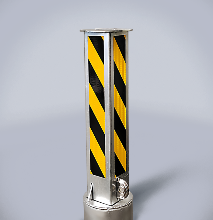 Carbon steel retractable bollard featuring black-and-yellow warning stripes, with lock and key positioned at the base of the column.