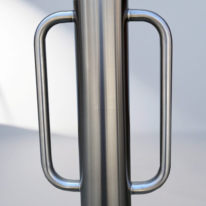 Close-up of the stainless steel handle on the D-type bollard bike rack, showing smooth welding lines and a brushed metal finish.