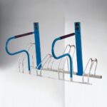 Blue e-bike parking rack made of metal with dark handles, showing a distinct structural style for electric bicycle storage.