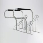 Silver galvanized Triangle stand bike rack with handles, featuring a simple design and durable metal finish for public bike parking.