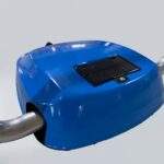 Close-up of blue solar parking lock body with smooth surface and visible solar panel, focusing on product details.