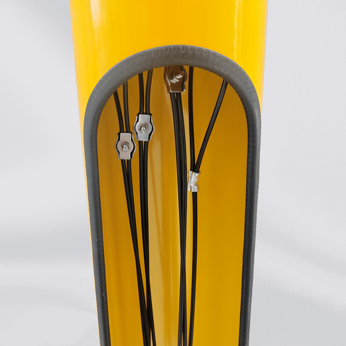 Interior view of yellow bicycle repair station tools, featuring visible wire rope and safety protection components.