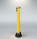 Side view of yellow fold down bollard showing built-in lock and key insertion, black base securely attached to the post.
