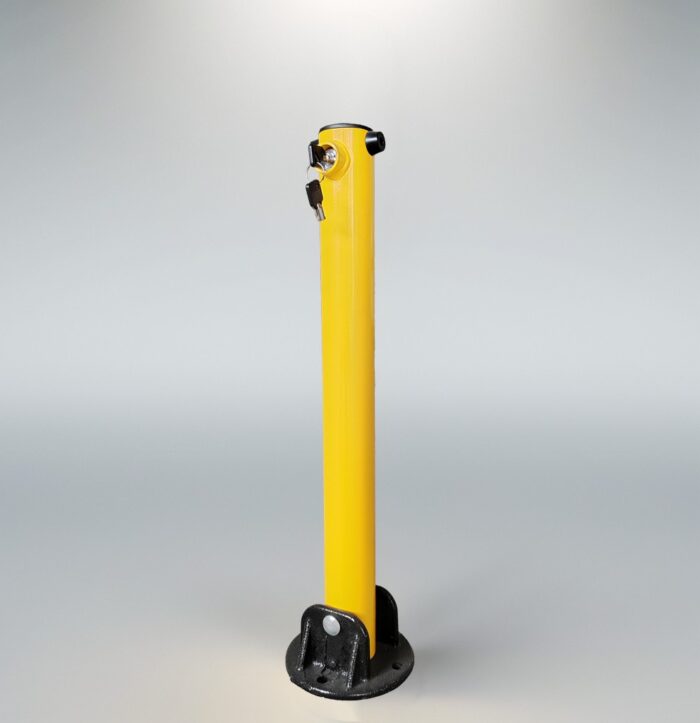 Side view of yellow fold down bollard showing built-in lock and key insertion, black base securely attached to the post.