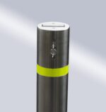 Close-up of stainless steel 114-type bridge-handle underground lock movable bollard with yellow warning band and top lock, designed for easy operation and management.