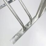 Close-up of galvanized steel Triangle stand bike rack with handles, highlighting welded joints and tube connections.