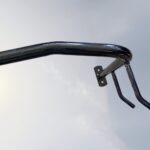 Partial view of C Type Wall Mount Bike Rack showing smooth metal surface and fine craftsmanship for secure bicycle mounting.