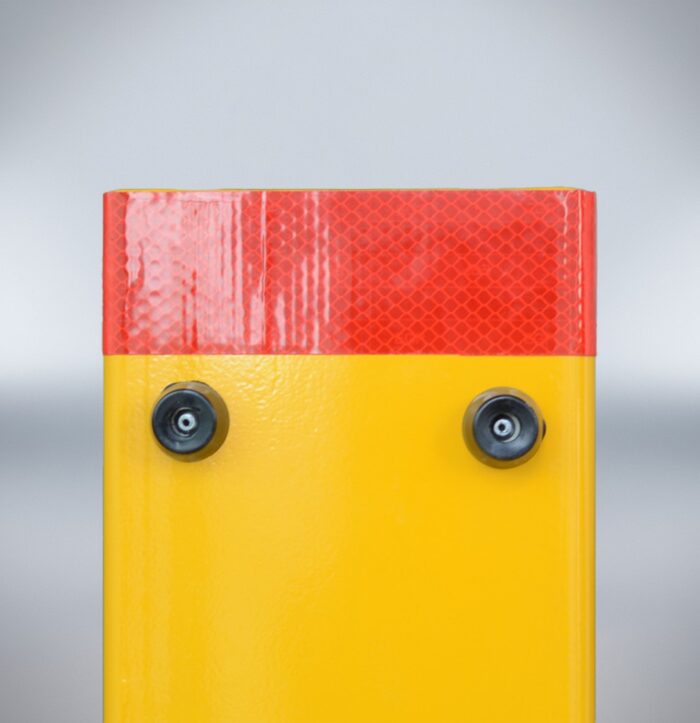 Front upper section of folding bollard with dual rubber stoppers and red reflector strip for approach-side visibility.