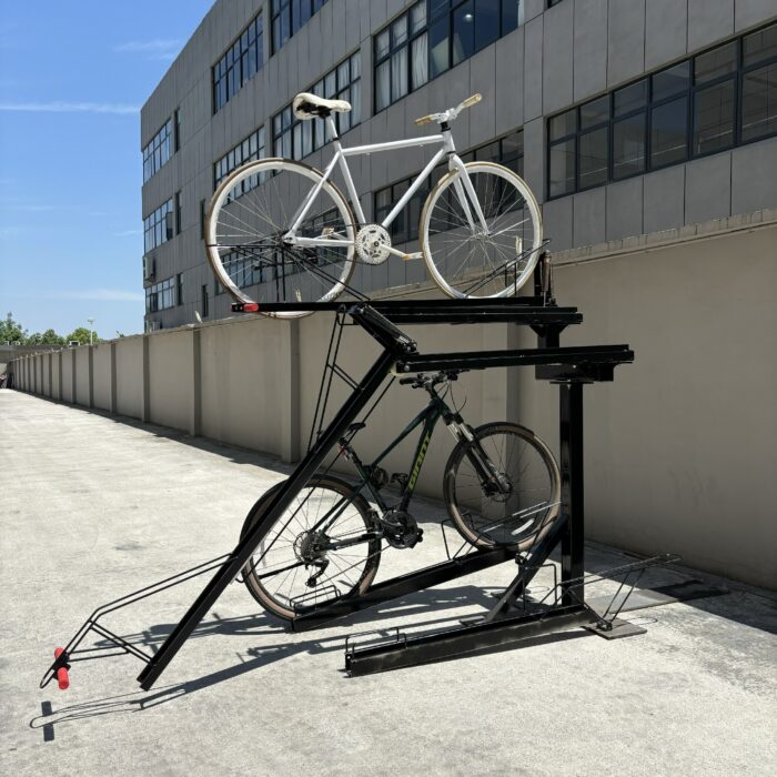 Outdoor installation of KAVASS dual-assisted bike rack holding white and black bicycles, showcasing its stability for external parking use.