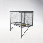 Side view of compact gray metal mesh wall-mounted locker with door closed and locked, showing internal yellow-black storage box and space-saving profile.