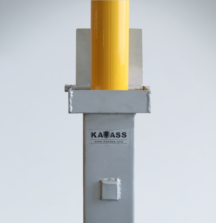 Close-up of raised retractable bollard with visible KAVASS logo, designed for traffic safety in public or commercial spaces.