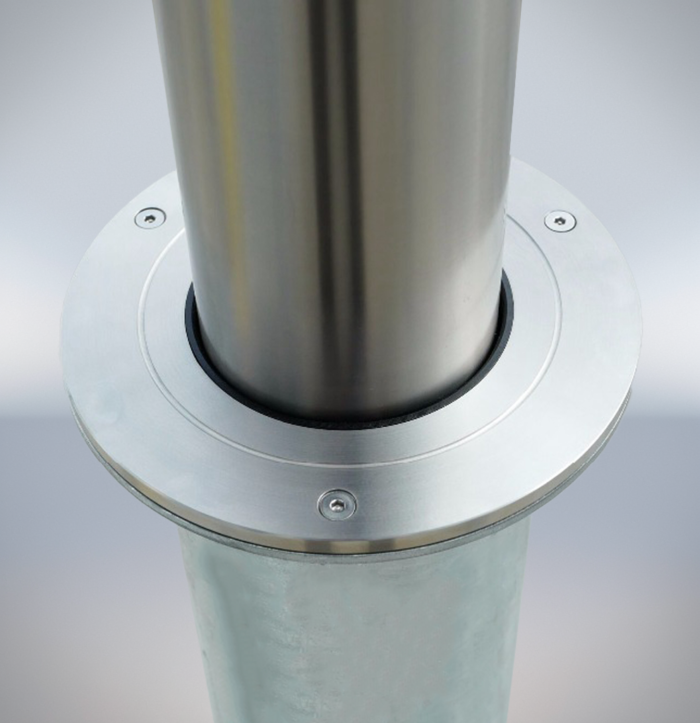Close-up of the middle connection part of a stainless steel telescopic bollard, showing column-to-base connection details.