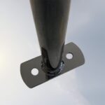Close-up of C Type Wall Mount Bike Rack base showing fixing holes and weld quality for stable wall installation.