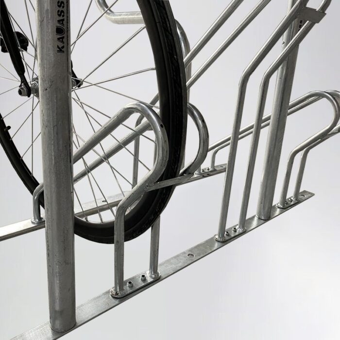 Bicycle parked on galvanized Triangle stand bike rack with handles, demonstrating real-world application and solid metal build.