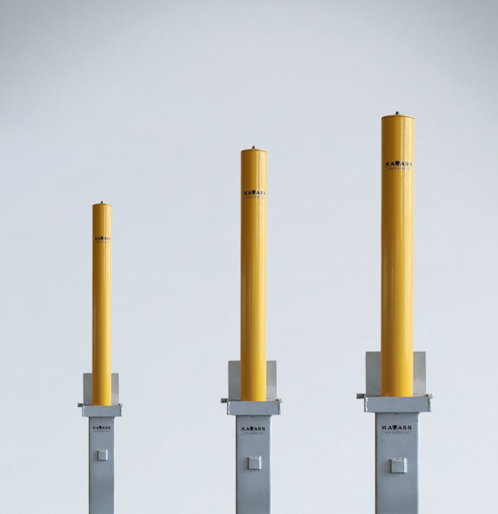 Heavy-duty carbon steel retractable bollards available in 76mm, 89mm, and 114mm diameters and 500mm to 670mm heights, designed for commercial parking and access control.