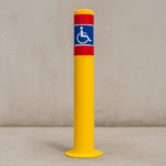 Installed Surface-Mounted Disabled Bollard in a real parking environment.